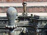 Kathmandu Bhaktapur 05-3 Bhaktapur Durbar Square Naga Pokhari Cobra Heads Close Up Naga cobra heads face each other in the Naga Pokhari in the Palace of 55 Windows in Bhaktapurs Durbar Square.